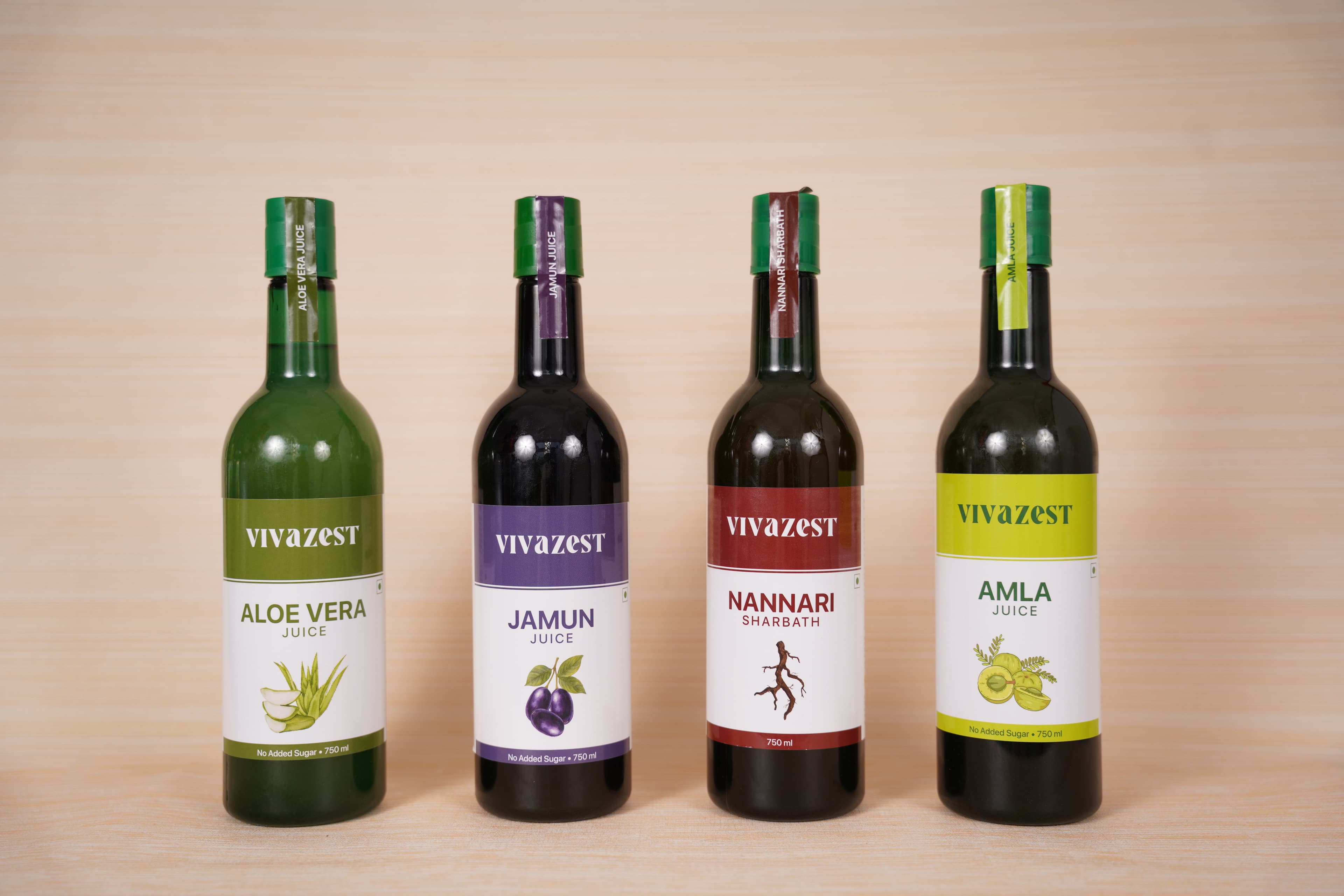 Lineup of Vivazest wellness juice bottles